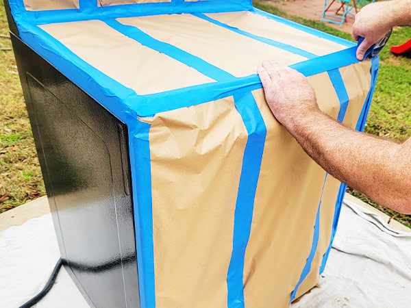 Covering stove with masking paper and painters tape